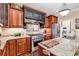 Well-equipped kitchen with stainless steel appliances, custom cabinets, granite countertops, and an adjacent laundry area at 315 14Th Ave. N, Surfside Beach, SC 29575