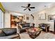Spacious living room featuring hardwood floors, a ceiling fan, and an open layout connecting to the kitchen at 315 14Th Ave. N, Surfside Beach, SC 29575