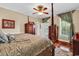 Main bedroom featuring a four-poster bed, hardwood floors, and elegant furnishings at 315 14Th Ave. N, Surfside Beach, SC 29575