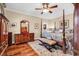 Main bedroom featuring a four-poster bed, hardwood floors, and elegant furnishings at 315 14Th Ave. N, Surfside Beach, SC 29575