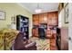 Cozy home office featuring custom built-in shelving, a comfortable chair, and warm lighting, perfect for productivity at 315 14Th Ave. N, Surfside Beach, SC 29575