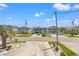 Coastal homes featuring ample parking, elevated construction, and charming architectural details on a sunny day at 325 N 58Th Ave. N, North Myrtle Beach, SC 29582