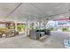Covered outdoor space with comfortable seating and a picnic table, perfect for entertaining at 325 N 58Th Ave. N, North Myrtle Beach, SC 29582