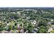 Aerial view of neighborhood homes surrounded by lush greenery and trees at 3533 Lighthouse Way, Myrtle Beach, SC 29577