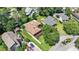 Aerial view of home showcasing backyard, neighboring houses, and lush trees at 3533 Lighthouse Way, Myrtle Beach, SC 29577