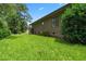 Expansive backyard featuring a well-kept lawn and mature landscaping at 3533 Lighthouse Way, Myrtle Beach, SC 29577