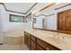 Large bathroom with double sinks, a soaking tub, and ample counter space at 3533 Lighthouse Way, Myrtle Beach, SC 29577