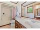 Classic bathroom with vanity, shower with curtain, and vintage-inspired wallpaper at 3533 Lighthouse Way, Myrtle Beach, SC 29577