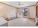 Bedroom area with window, crib, and rocking chair provides a cozy and inviting space at 3533 Lighthouse Way, Myrtle Beach, SC 29577
