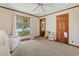 Bedroom with large window, comfortable chair, and room for play and relaxation at 3533 Lighthouse Way, Myrtle Beach, SC 29577