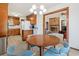 The dining area features a unique chandelier and transitions into kitchen and living spaces at 3533 Lighthouse Way, Myrtle Beach, SC 29577
