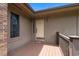 Charming front door with a cozy porch and stylish exterior lighting at 3533 Lighthouse Way, Myrtle Beach, SC 29577