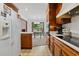 Bright kitchen with white appliances transitions into a dining space with backyard views at 3533 Lighthouse Way, Myrtle Beach, SC 29577
