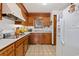 Updated kitchen features modern appliances, wooden cabinets and stylish flooring at 3533 Lighthouse Way, Myrtle Beach, SC 29577