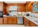 Functional kitchen with classic cabinets and a bright countertop, perfect for cooking at 3533 Lighthouse Way, Myrtle Beach, SC 29577