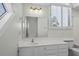 Well-lit bathroom with a clean, white vanity and elegant lighting fixtures at 3835 Masters Ct. # 135, Myrtle Beach, SC 29577