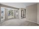 Spacious bedroom with neutral colors, large windows, and a mirrored closet at 3835 Masters Ct. # 135, Myrtle Beach, SC 29577