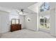 Spacious bedroom boasting unique windows, a ceiling fan, and a classic wooden dresser at 3835 Masters Ct. # 135, Myrtle Beach, SC 29577