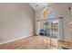 Bright living room featuring vaulted ceilings and a view of the screened-in back patio at 3835 Masters Ct. # 135, Myrtle Beach, SC 29577