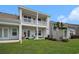 Relaxing backyard view with upper deck, patio, and well-maintained lawn, ideal for outdoor enjoyment at 4051 Mclamb Ave. # 4051, Little River, SC 29566