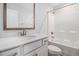 Bathroom vanity featuring a framed mirror, modern faucet, and white cabinets at 4051 Mclamb Ave. # 4051, Little River, SC 29566