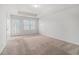 Bedroom featuring neutral carpeting, a ceiling fan, and a sliding glass door leading to a balcony at 4051 Mclamb Ave. # 4051, Little River, SC 29566