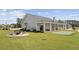 View of the community clubhouse with a fireplace, putt-putt golf, and spacious patio seating at 4051 Mclamb Ave. # 4051, Little River, SC 29566