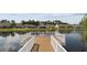 Picturesque waterfront view from the community dock, with peaceful lake reflections and surrounding homes at 4051 Mclamb Ave. # 4051, Little River, SC 29566