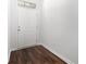 Bright entryway featuring sleek wood floors and a modern white door at 4051 Mclamb Ave. # 4051, Little River, SC 29566