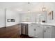 Open kitchen with quartz counters, stainless steel appliances and hardwood floors flows into the living area at 4051 Mclamb Ave. # 4051, Little River, SC 29566