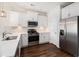 Well-lit kitchen with stainless steel appliances, quartz countertops, and stylish white cabinetry at 4051 Mclamb Ave. # 4051, Little River, SC 29566