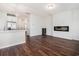 Spacious living room featuring hardwood floors, an electric fireplace, and an open layout at 4051 Mclamb Ave. # 4051, Little River, SC 29566