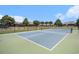 Community tennis/pickleball court provides recreational fun amidst green landscaping and clear skies at 4051 Mclamb Ave. # 4051, Little River, SC 29566