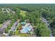 Aerial view of a community pool and recreational area surrounded by lush trees at 4539 Fringetree Dr., Murrells Inlet, SC 29576