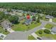 Aerial view of charming home nestled in a lush, green neighborhood with mature trees and well-maintained lawns at 4539 Fringetree Dr., Murrells Inlet, SC 29576