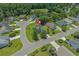 Aerial view of home showcasing the surrounding neighborhood, lush landscaping, and mature trees at 4539 Fringetree Dr., Murrells Inlet, SC 29576