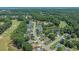 Aerial view of a neighborhood with a golf course, lake, and lush green trees at 4539 Fringetree Dr., Murrells Inlet, SC 29576