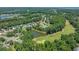 Scenic aerial view of community featuring mature trees, a pond, and a golf course at 4539 Fringetree Dr., Murrells Inlet, SC 29576
