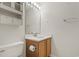 Well-lit bathroom featuring a single sink vanity, framed mirror, and classic white fixtures at 4539 Fringetree Dr., Murrells Inlet, SC 29576