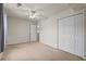 Bedroom featuring neutral carpet, a ceiling fan, and a double closet, providing comfortable space and storage at 4539 Fringetree Dr., Murrells Inlet, SC 29576