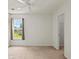 Bedroom has neutral carpet and a window overlooking the neighborhood, with easy access to the closet at 4539 Fringetree Dr., Murrells Inlet, SC 29576