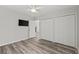 Bedroom features a ceiling fan, double closets, a TV and wood floors for a stylish, comfortable space at 4539 Fringetree Dr., Murrells Inlet, SC 29576
