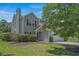Charming home with gray siding, green shutters, well-maintained landscaping, and an attached two-car garage at 4539 Fringetree Dr., Murrells Inlet, SC 29576