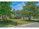 Charming two-story home with well-manicured lawn, lush landscaping, and attached garage at 4539 Fringetree Dr., Murrells Inlet, SC 29576