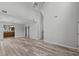 Open-concept living area with high ceilings, wood-look floors, and a seamless flow to the adjacent rooms at 4539 Fringetree Dr., Murrells Inlet, SC 29576