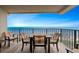 Balcony with table and chairs overlooking the ocean at 517 S Ocean Blvd. # 705, North Myrtle Beach, SC 29582