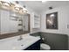 Bathroom features a vanity with mirror, commode, and shower at 517 S Ocean Blvd. # 705, North Myrtle Beach, SC 29582
