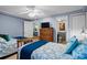 Cozy bedroom with two beds, ceiling fan, tv, and ensuite bathroom at 517 S Ocean Blvd. # 705, North Myrtle Beach, SC 29582
