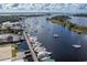 Aerial view of a marina with multiple boats docked and buildings along the waterfront at 528 George Washington Trail, Georgetown, SC 29440