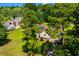 Aerial view of house with solar panels, lush lawn, and mature landscaping at 528 George Washington Trail, Georgetown, SC 29440